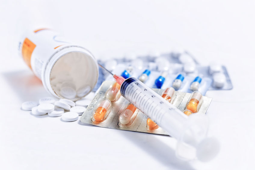 Syringe with glass vials and medications pills Syringe with glass vials and medications pills
